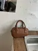 Bolso de mano de patrón tejido de nicho transfronterizo, nuevo bolso tipo bowling retro elegante para mujer, bolso de hombro y cruzado