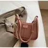 Nuevo bolso de hombro versátil de comercio exterior para mujer 2026, bolso cruzado suave de alta gama con lazo de perlas, bolso de axila a la moda