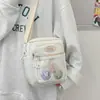 Bolsa feminina popular deste ano 2024 novo modelo bolsa de ombro versão coreana bolsa transversal color blocking cor doce tecido de nylon comércio exterior