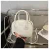 Bolsa Feminina Design Nicho Estilo Coreano 2025 Nova Retrô Simples Bolsa de Mão Textura para o Dia a Dia Bolsa Transversal Redonda