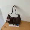 Bolso de moda transfronterizo estilo coreano 2026 otoño nueva moda bolso versátil tipo empanada para ir al trabajo, bolso de hombro y cruzado simple