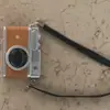 1688 Muñeca Cara Sonriente Cinta Cámara de Sonido Luminosa Colgante Juguete Cámara Mini Realista Muñeco de Peluche