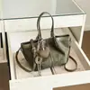 Bolsa de mano retro de alta gama para mujer, nuevo modelo 2026, diseño único, bolso de hombro no convencional, bolso de mano para el día a día