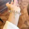 Pulsera de Cristal Blanco Imitación Transparente Hielo de Lujo Ligero de 10 mm con Lazo Microincrustado para Mujer Pulsera Fresca Elegante de Verano
