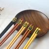 Venta al por mayor de fábrica palillos hexagonales creativos cinco palillos de madera palillos de regalo japoneses palillos vajilla de madera al por mayor