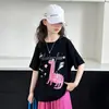 Conjunto de Dos Piezas Estilo Americano con Bloques de Color Estampados y Mangas Cortas, Camiseta Holgada para Chicas de Secundaria, Nuevo Conjunto de Pantalones Anchos 2026