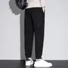 Pantalones casuales ajustados cónicos de forro polar Boao para otoño e invierno con puños elegantes