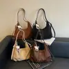 Bolso de hombro vintage de gran capacidad para mujer, nuevo bolso cruzado de otoño 2026, bolso tote versátil de alta gama, bolso tipo empanada