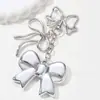 Venta Caliente Transfronteriza Dulce y Fresco Exquisito Moda Acrílico Lazo Forma de Corazón Estrella de Cinco Puntas Llavero Colgante para Mochila de Estudiante