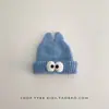 Gorro de inverno infantil, quente e espesso, com um design engraçado apresentando olhos grandes, estilo de puxar e proteção para as orelhas, adequado para meninos e meninas, e estiloso