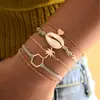 Atacado de joias de mão transfronteiriças concha amor nó de coco corda trançada pulseira de liga Europa e Estados Unidos conjunto de 5 peças fornecimento