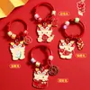 Dragón lindo año del dragón metal dragón etiqueta pequeña colgante Año Nuevo llavero de coche accesorios para bolso regalo pequeño para pareja venta al por mayor