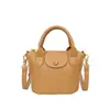 La popular bolsa pequeña texturizada de este año 2023 nueva bolsa para mujer de moda estilo western versátil bandolera bolso cubo portátil