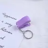 Mini grapadora de dibujos animados creativos transfronteriza con múltiples diseños para elegir, estilo llavero portátil, regalos de papelería para estudiantes al por mayor