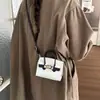 Otoño 2026 Nuevo Mini de Alto Valor Moderno Sencillo Elegante Temperamento Versátil Bolso Kelly de un Hombro Cruzado de Mano