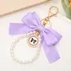 Llavero Creativo de Cadena con Perlas y Lazo Colgante de Moda para Bolsos de Mujer Llavero de Coche Lazo Flotante Personalizado