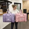 Bolsa de almacenamiento de viaje de gran capacidad, portátil para hombres y mujeres, bolsa de equipaje para gimnasio en rosa, morado, negro, diseño simple y elegante