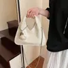 Bolsa de Braço de Luxo Feminina 2025 Nova Textura Moda Feminina Versátil Design de Nicho Celebridade da Internet Bolsa de Ombro de Mão