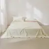 Lençol de flanela 100% algodão, cor sólida, novo de 2026, de alta qualidade, leve e luxuoso, espessado para uso doméstico, apresentando um design simples e elegante.