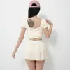 Novo Conjunto de Yoga Feminino com Bojos, Costas Cruzadas em Renda Bonitas, Manga Curta, Cintura Alta, Emagrecedor, Esportivo, Conjunto de Saia Plissada