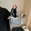 Las populares bolsas pequeñas de este año para mujer 2025 nuevo verano versátil bolsa de axila nicho sensación de alta gama bolso de hombro cruzado
