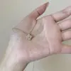 Colar de trevo de quatro folhas dourado para mulheres, corrente para clavícula, elegante, luxo leve, nicho, alta qualidade, simples, moderno, design versátil, novo modelo