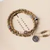 Sándalo verde DIY anillo de correr pulsera especificaciones 0.6 para hombre y mujer estilo simple cuentas Wen jugar joyería fabricantes al por mayor cuentas de Buda