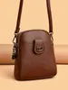 Bolso para teléfono móvil de mujer, nuevo modelo de primavera, bolso pequeño de cuero PU suave con patrón de lichi, bolso pequeño vertical multicapa, bolso de hombro cruzado para mujer, moderno