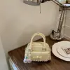 Bolso de mano de comercio exterior para mujer 2026 nuevo diseño de nicho de verano bolso de hombro cruzado retro bolso tipo almohada para commuting
