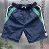 Verano 2026 Nuevo Estilo Japonés Simple Color Sólido Secado Rápido Pantalones Cortos Finos para Hombre Casual Cintura Elástica Holgados de Cinco Puntos