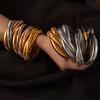 Pulsera europea y americana de alta gama de acero de titanio de moda transfronteriza de cara ancha con garganta de ganso, tendencia personalizada, combinación de colores, tres círculos, hueso de serpiente, acero de titanio dorado