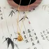 Tienda de Oro Mismo Estilo Joyería Chapada en Oro Collar Bolsa de la Suerte para Mujer Cadena para Clavícula Imitación Oro de Alto Gama Nicho Cadena al por Mayor