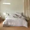 Grado A para maternidad e infantil, 100% algodón, jacquard teñido en hilo de doble capa de gasa, juego de cuatro piezas, algodón puro ultra suave, adecuado para dormir directamente sobre él, disponible en tamaños individual y doble