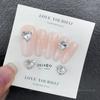 Arte de uñas K9 joyería taladro transparente Super Flash corazón torcido taladro de hacha gotas de agua cuadrado grueso mariposa diamante blanco accesorios para uñas al por mayor