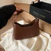 Bolsa de axila de cor sólida nicho, bolsa de ombro fashion, bolsa pequena para mulheres, novo modelo outono 2026, bolsa de ombro simples e moderna