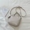 Bolso tipo cubo de diseño nicho transfronterizo para mujer, nuevo y moderno 2026, versátil bolso de hombro y cruzado con textura de alta calidad