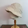 Sombrero de pescador de lino plisado estilo japonés para mujer, transpirable, adelgazante, versátil, bloqueador solar, sombrero tipo cubeta con protección solar