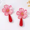 Nueva tendencia de moda transfronteriza Estilo de corte pendientes de flor retro flor de metal gota de aceite Pendientes de temperamento Joker para mujer