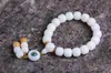 Material de intemperie de raíz de Bodhi de Jade Blanco de Hainan hecho a mano pulido en seco alto lanzamiento espaciador de cuerda trenzada colgante de loto tallado pulsera pulsera