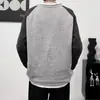 Nuevo suéter grueso de estilo casual de peso pesado para otoño e invierno, versión coreana para hombres y mujeres, chaqueta de punto color block de manga raglán holgada de marca moderna