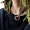 Collar con colgante de alas de amor de aceite de gota Joker de moda hip-hop nicho de alta gama europeo y americano para mujer, outlet de fábrica