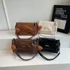 Bolso de Gran Capacidad para Mujer bajo el Brazo 2025 Nuevo Estilo Bolso de Mano Minimalista Francés Texturizado Bolso de Hombro con Cadena Moda Venta al por Mayor