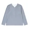 Camiseta suelta de manga larga de dos piezas falsas para hombre, primavera y otoño, marca de moda INS, con bloques de color, cuello redondo, top casual texturizado