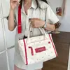 Bolso de Hombro de Lona Nuevo Diseño de Nicho 2026 Versión Coreana Bolso Tote de Nicho para Mujer Ligero Bolso de Hombro Sencillo
