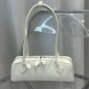 Primavera e verão 2025 Nova bolsa bagel de couro bovino com alça longa, nicho francês, vintage, couro legítimo, bolsa de ombro feminina