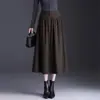 Moda de falda midi de punto en línea A para mujer, nueva colección otoño 2026, de cintura alta, fluida, corte holgado, versátil y con dobladillo ancho