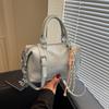Bolso de mano de alta gama tipo almohada para mujer, nuevo de moda primavera 2025, bolso de hombro moderno, diseño de nicho, bolso casual para mujer