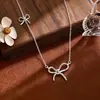 Collar de plata de ley s925 con lazo para mujer, lujo ligero, alta gama, cadena para clavícula de nicho, cadena para el cuello dulce y versátil, venta al por mayor para verano