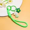 Venta al por mayor de pequeños, frescos, estilo coreano, flor de girasol acrílica, flor de goma suave, cordón trenzado hecho a mano, accesorios para cordón de teléfono