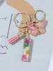 Suministros del Fabricante Llaveros con Flores Secas Prensadas 26 Letras del Alfabeto Inglés Llaveros con Borla de Mariposa Charms para Bolsos de Mujer